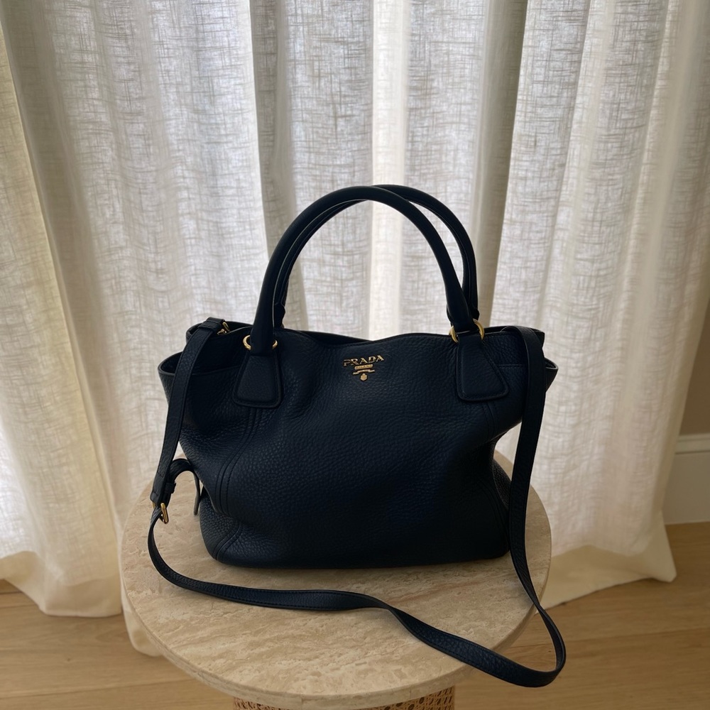Prada leather tote bag with Straps and handle.